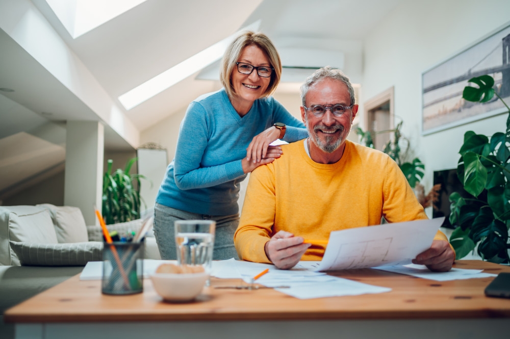 Fixed income investments second image - showing a couple looking at property plans