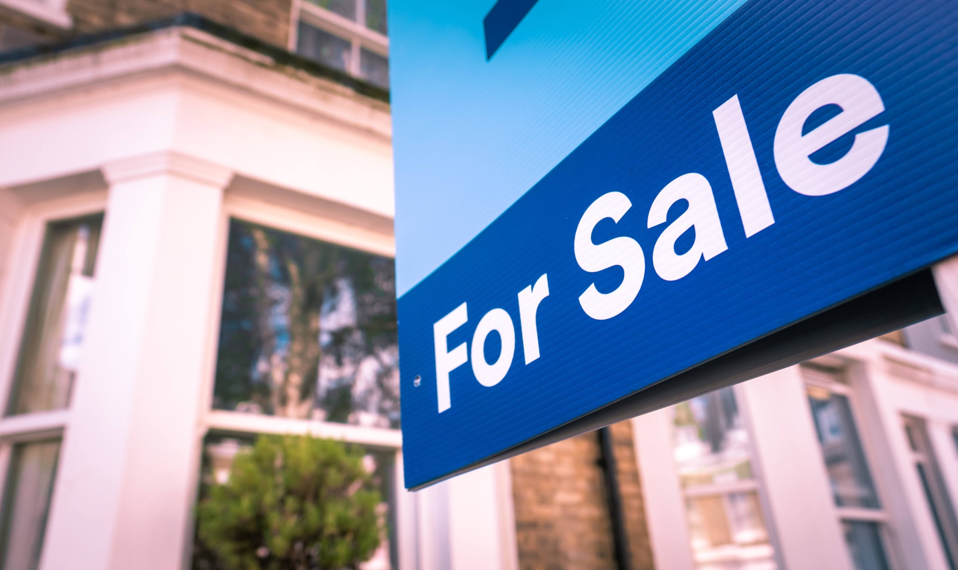 Direct v indirect investing main image - showing a for sale sign in front of a house