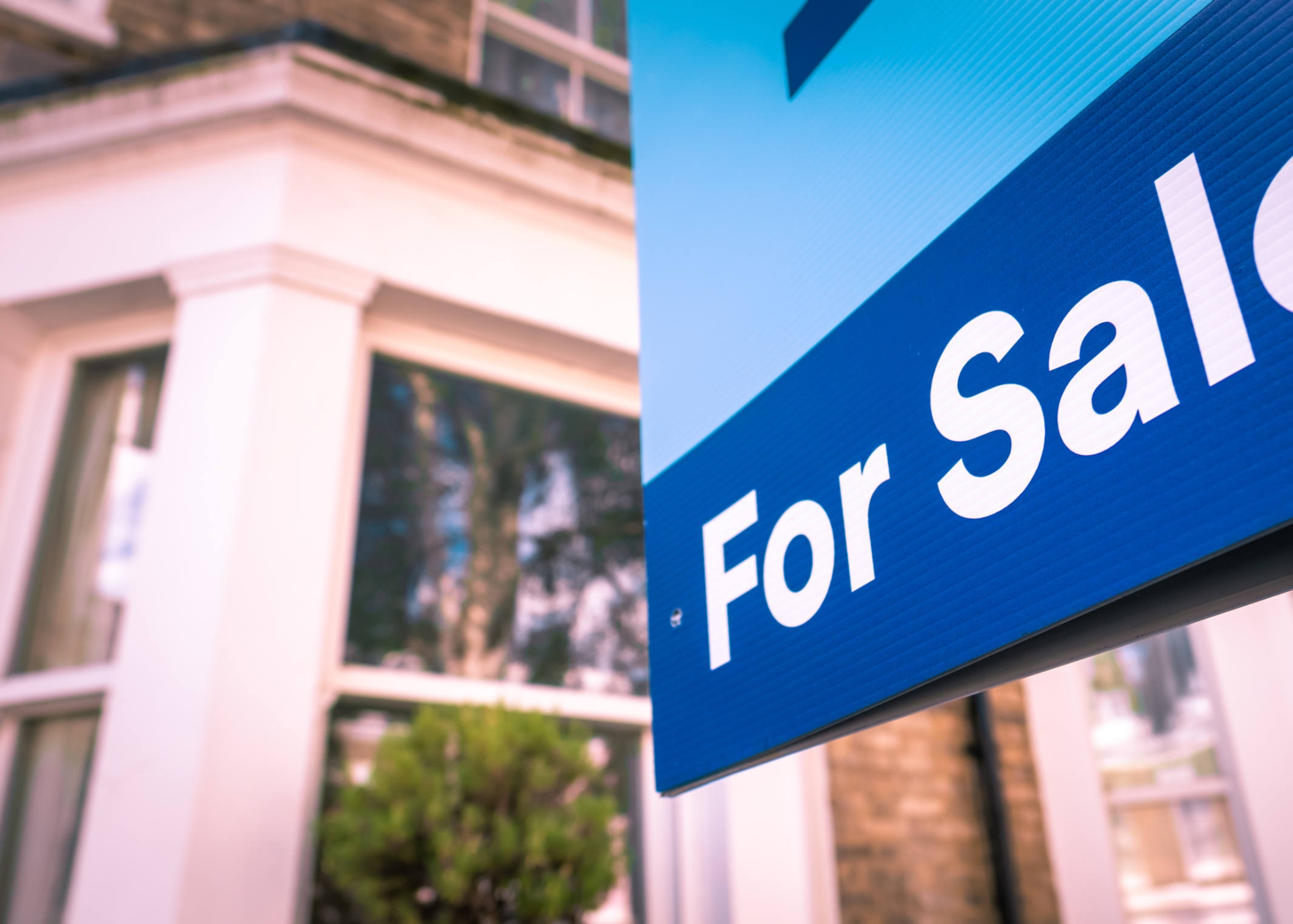 Direct v indirect investing main image - showing a for sale sign in front of a house