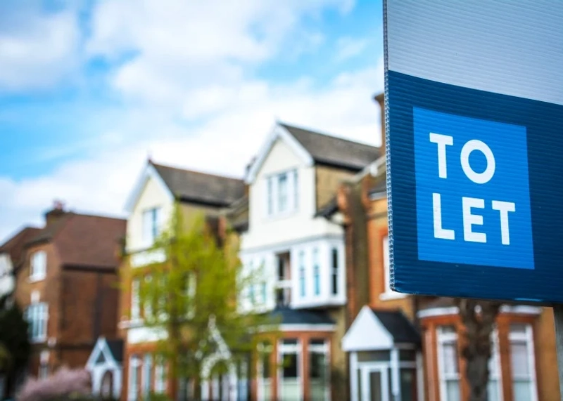 A "to let" sign outside a Victorian home in London.