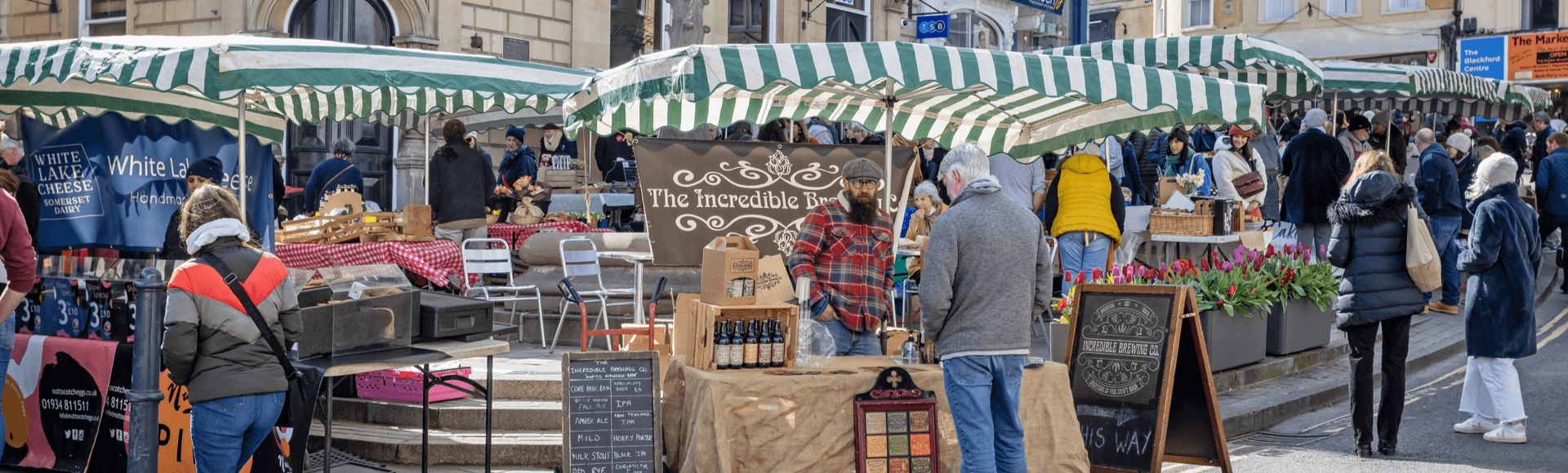 Brewery stall at Frome Sunday Market on a sunny day in Frome, Somerset, Acorn Property Invest